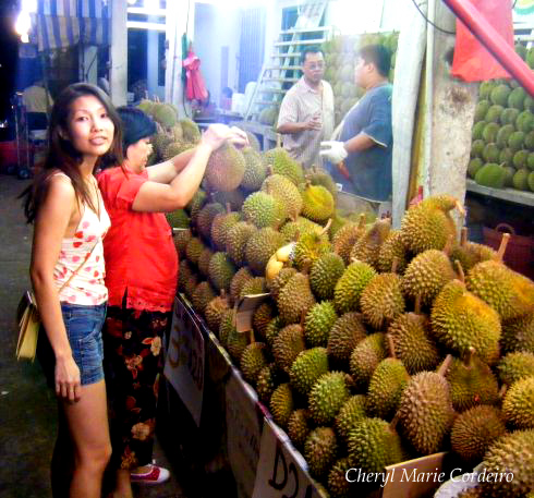 Choosing durians in Singapore, along Geyland Road