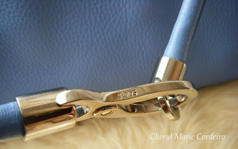 Silver tone hardware on Tods bag