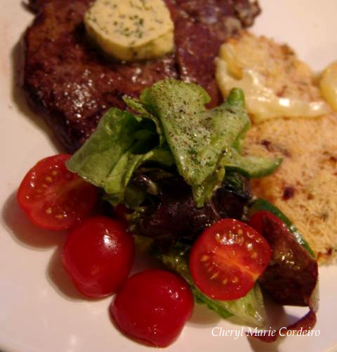 Boysenberry vinaigrette salad served with beef entrecote