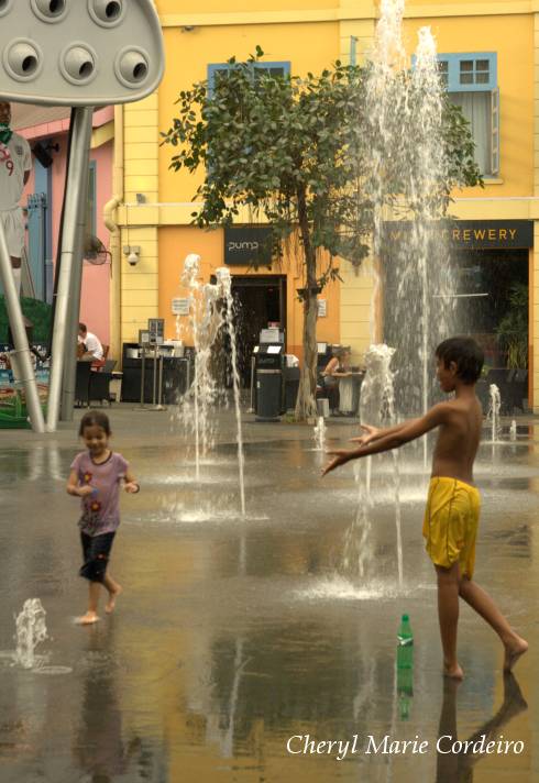 Children playing in fountain, Clarke Quay, Singapore.