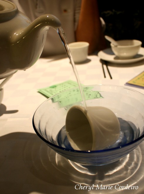 Rinsing of cups with hot water or even tea.