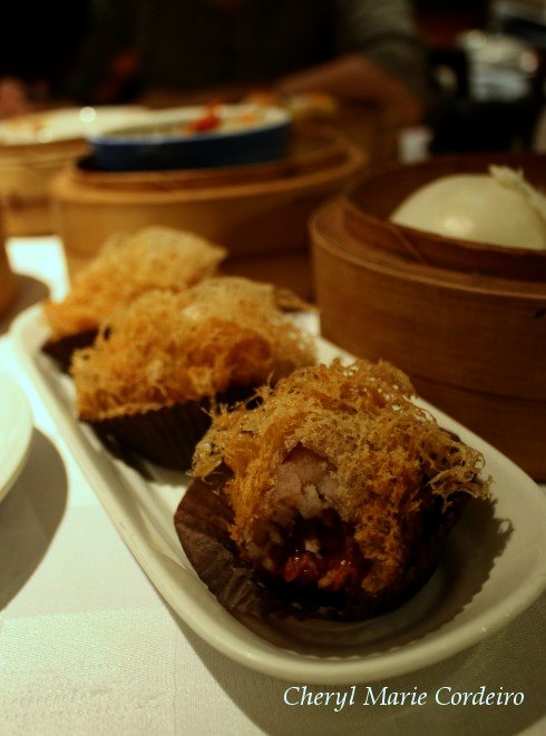 Yam and charsiew or sweet meat fried dumplings, dim sum Hong Kong.