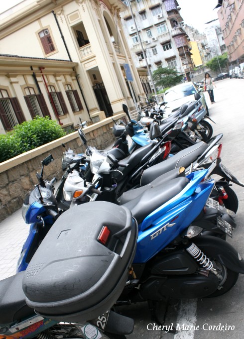Scooters and motorcycles, common mode of transport, Macau.