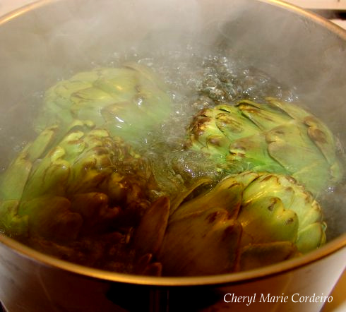 Artichokes boiling in a pot