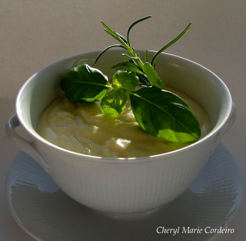 Aioli with some fresh basil and rosemary as decoration