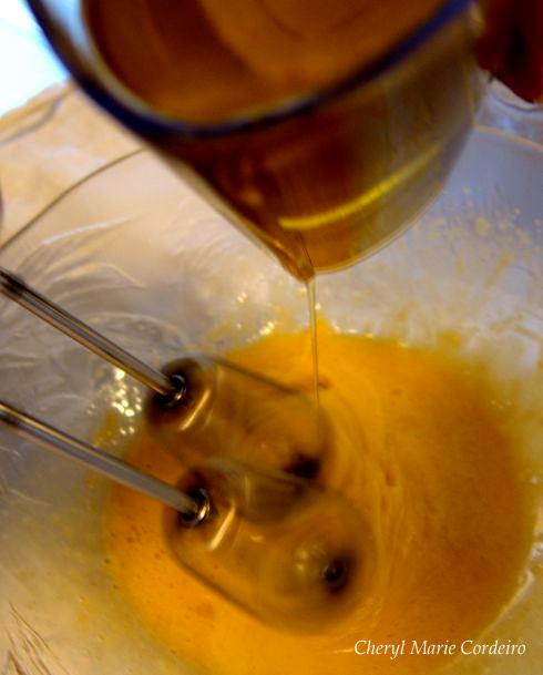 Blending the oil into the egg yolks