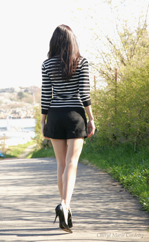 Black and white top with black Warehouse shorts and Roberto Cavalli heels