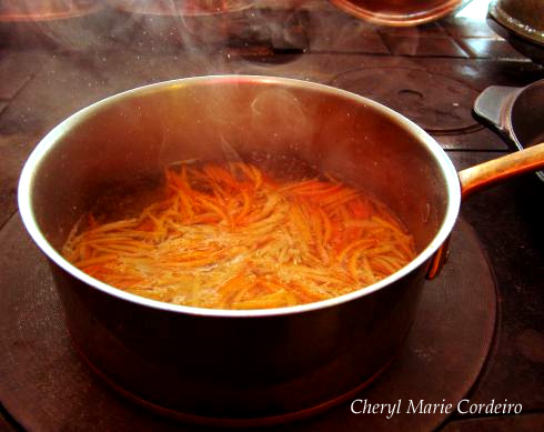 Orange and lemon rinds cooking to soften them