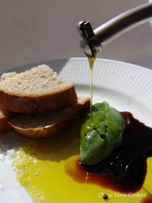 Bread, olive oil, balsamic vinegar with fresh basil and sea salt at Cheryl Marie Cordeiro