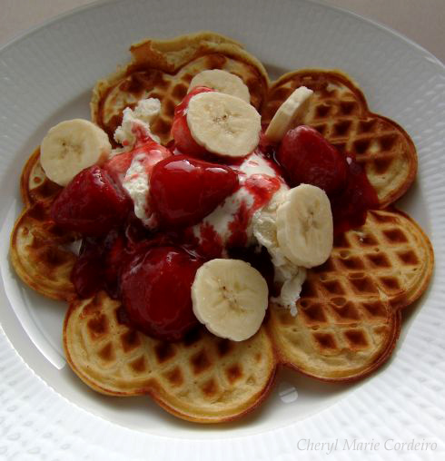 Strawberry and banana topped waffle