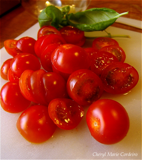 Ripened cherry tomatoes sliced and ready for marinating. At Cheryl Marie Cordeiro