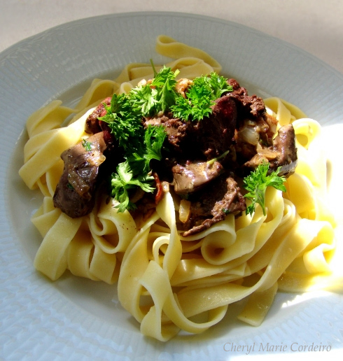 Chicken liver with XO and pasta, topped with fresh parsley. At Cheryl Marie Cordeiro