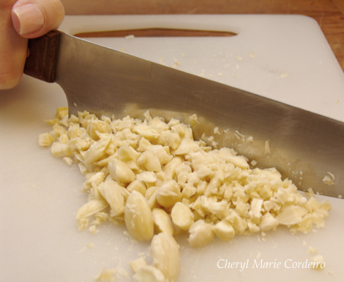 Rough chopping the almonds, at Cheryl Marie Cordeiro