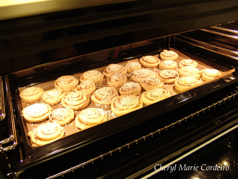 Cinnamon rolls, in the oven, before baking
