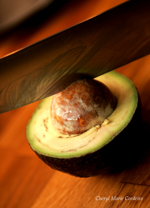 The avocado seed is removed with a twist of the knife.