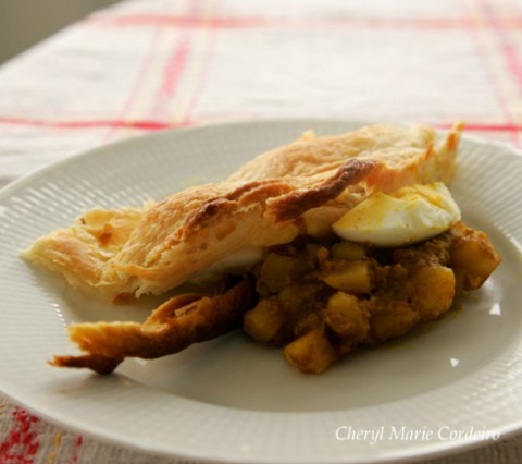 Curried potatoes and egg, pot pie style with puff pastry.