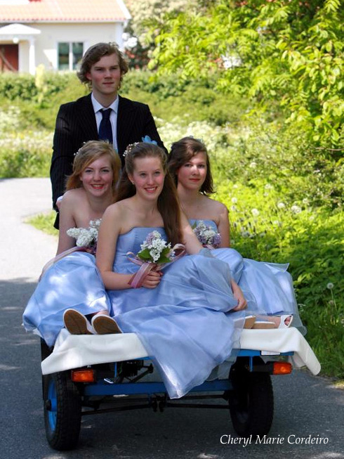 Bridesmaids on a moped, mode of transport in the southern archipelago of Gothenburg, Sweden
