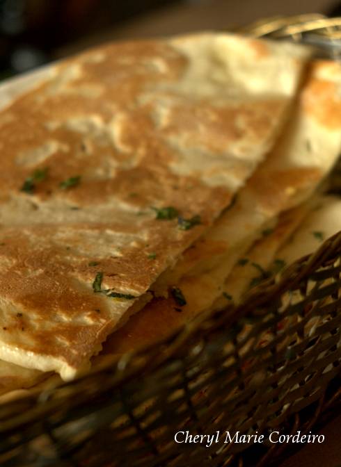 A naan basket, with a variety of naan types, Muthu's Curry, Singapore.