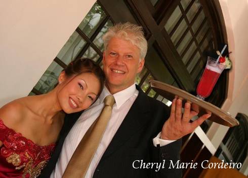 Cheryl Marie Cordeiro and Jan-Erik Nilsson, Raffles Hotel, Singapore with the Singapore Sling, outside East India Room.