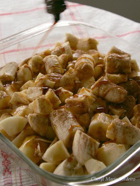 Apples and bananas, chopped, drizzled with dark syrup.