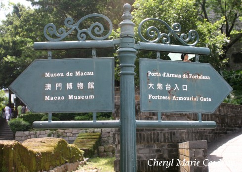 Signs at St. Paul's Ruins and The Museum of Macau.