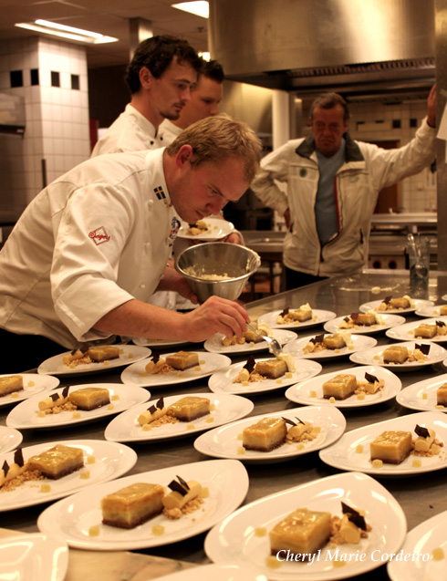 Jimmy Wollberg working on the dessert plates while Chairman of the Swedish Chefs Association, Rolf Sjödin looks on.