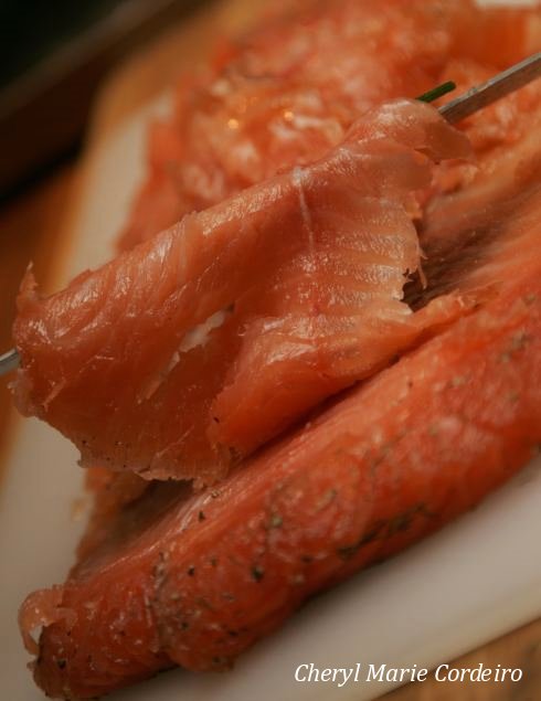 Slicing the salmon.