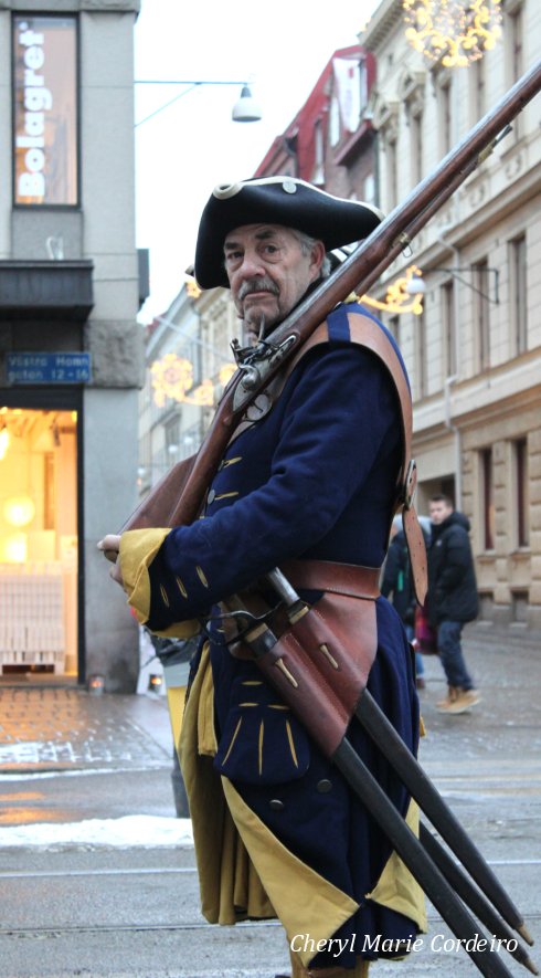 Soldier in full regimental gear on his way to Kronhuset.